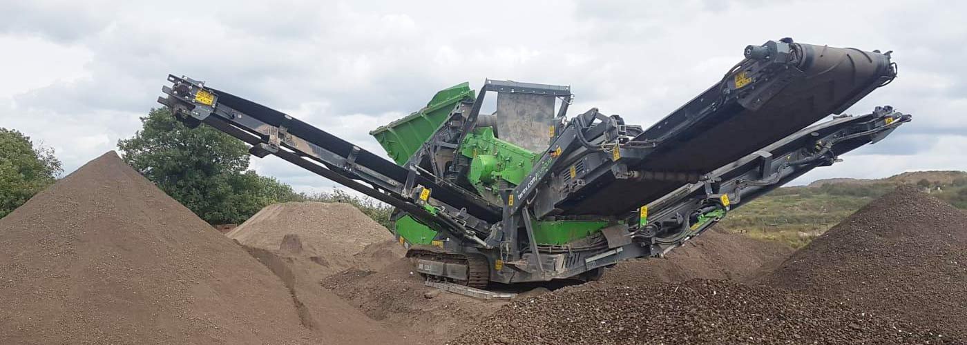 Materials are segregated, graded and turned into recovered top soil aggregates sand and gravel